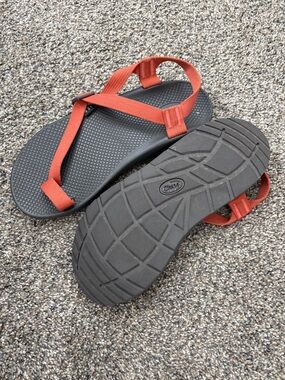 Chaco Bodhi sandals featuring orange straps and grey soles